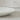 Witte Sample Flute Tafel van Ditto Design, close-up van de elegante, moderne tafel met witte afwerking.